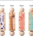 Four wooden balance blocks with animal illustrations shown from front, side, and back views on a white background.