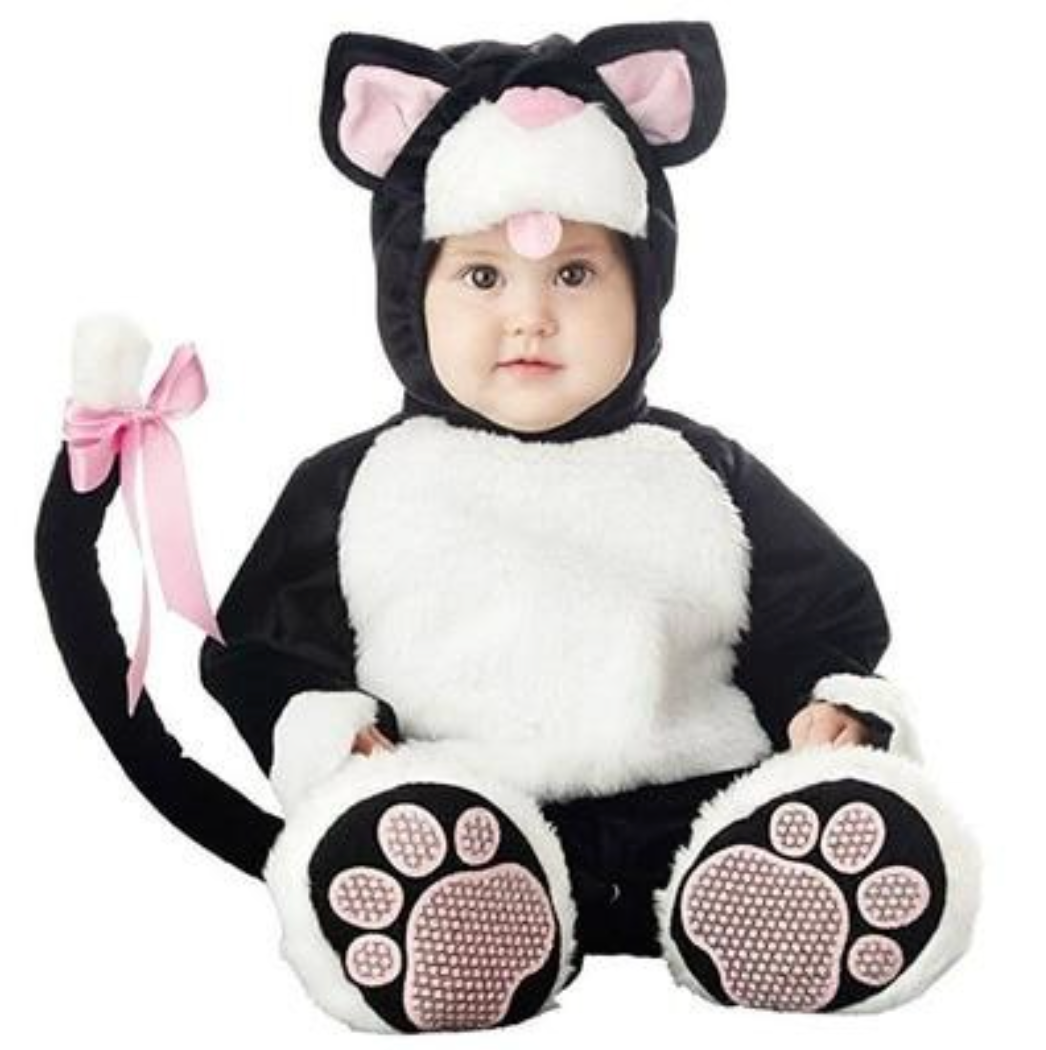 A baby wearing a black and white cat costume with pink accents, including a hood with cat ears, a pink nose, and a long tail with a pink bow. The costume includes paw-print covered feet.