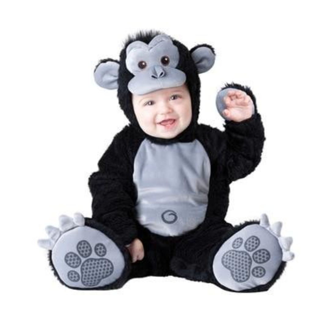 A baby wearing a plush gorilla costume, sitting against a plain white background. The costume is black with a gray belly panel, gray ears, and gray paw pads with white claw details.