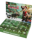 A dinosaur-themed Advent Calendar display box with 12 numbered green doors and a printed front panel showing dinosaurs, a Christmas tree, and holiday decorations. The box is photographed on a plain white background.