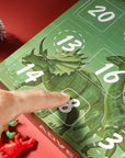 Advent calendar with dinosaur design and visible days, on a red background.