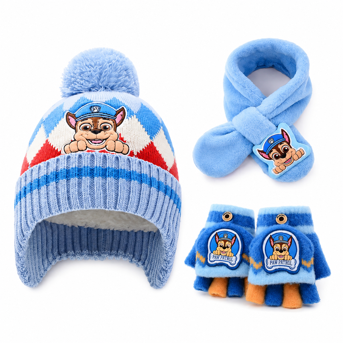 A Paw Patrol-themed baby winter hat, scarf, and mittens set on a white background. The light blue knit hat features a fluffy pom-pom, a red and white argyle pattern, and a cartoon puppy graphic.