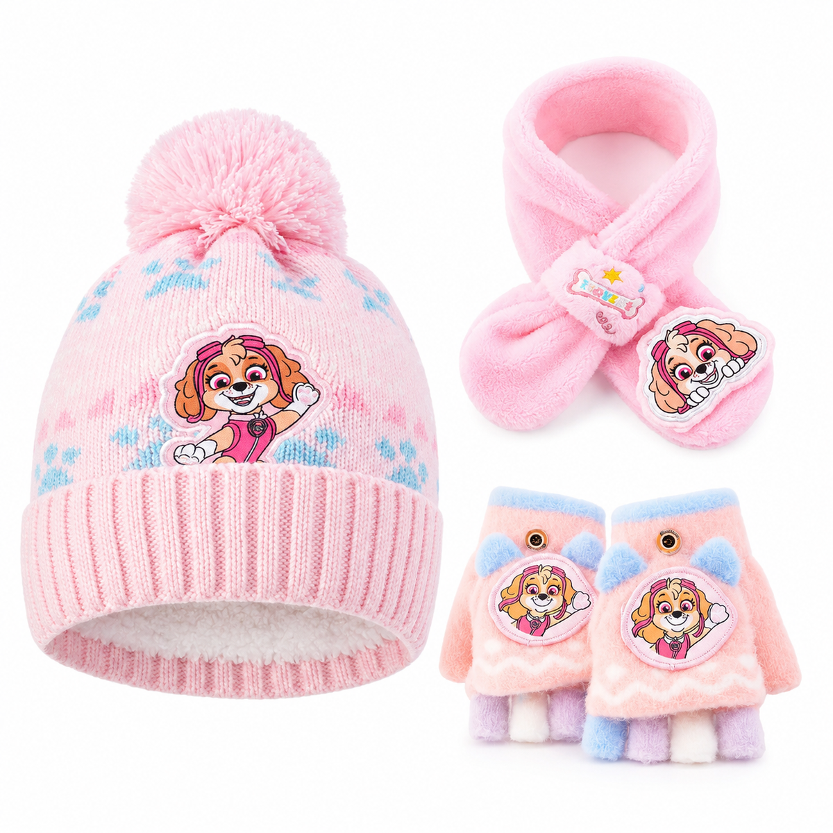 A children's winter hat, scarf, and fingerless glove set in pink, featuring a cartoon dog character patch on each item and pastel paw-print details on the hat.